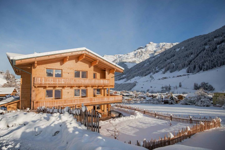 House Alpenprinzessin covered and surrounded by a snowy landscape