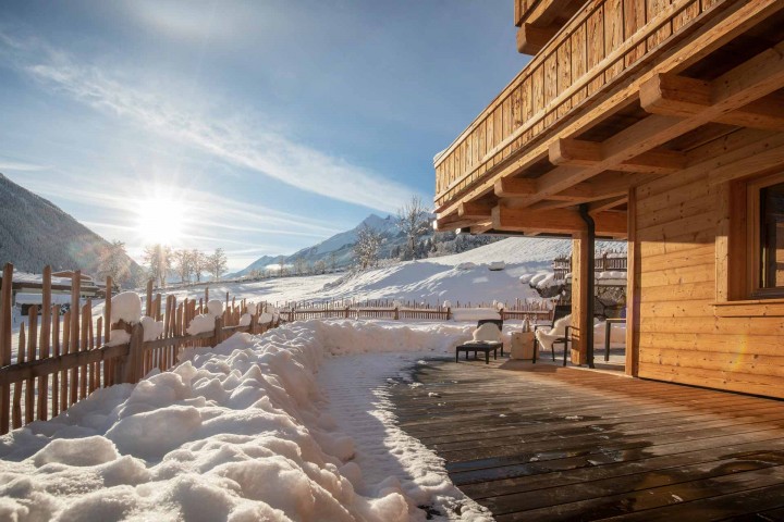 Snow-covered terrace in the sunshine at Haus Alpenprinzessin